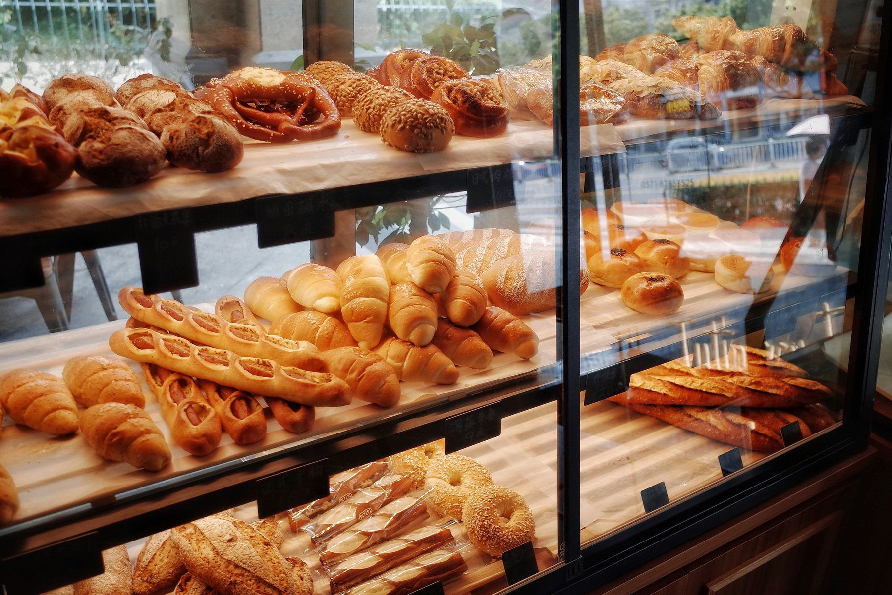 Bakery window full of bread and pastries