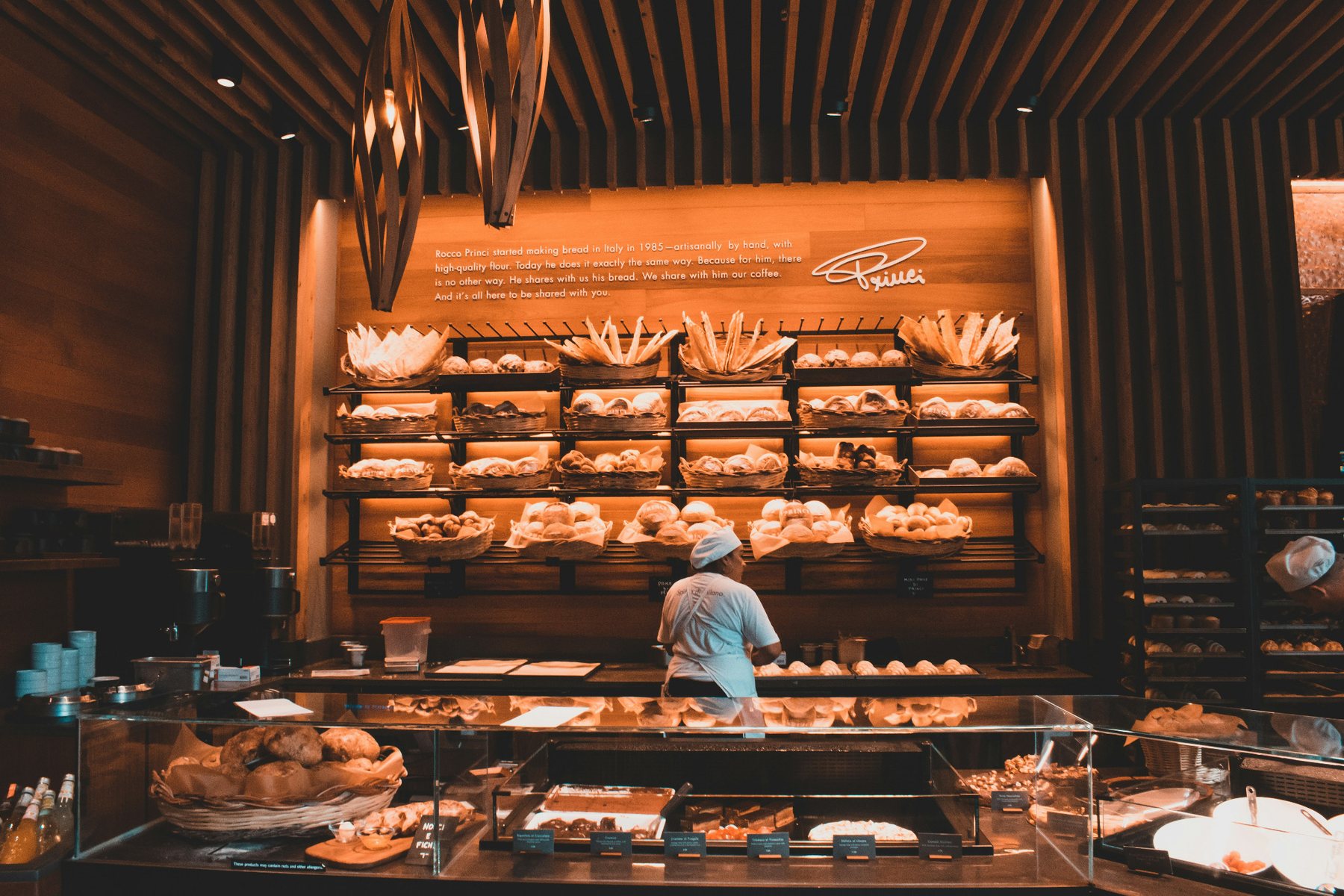 Warm bakery counter with bread displays