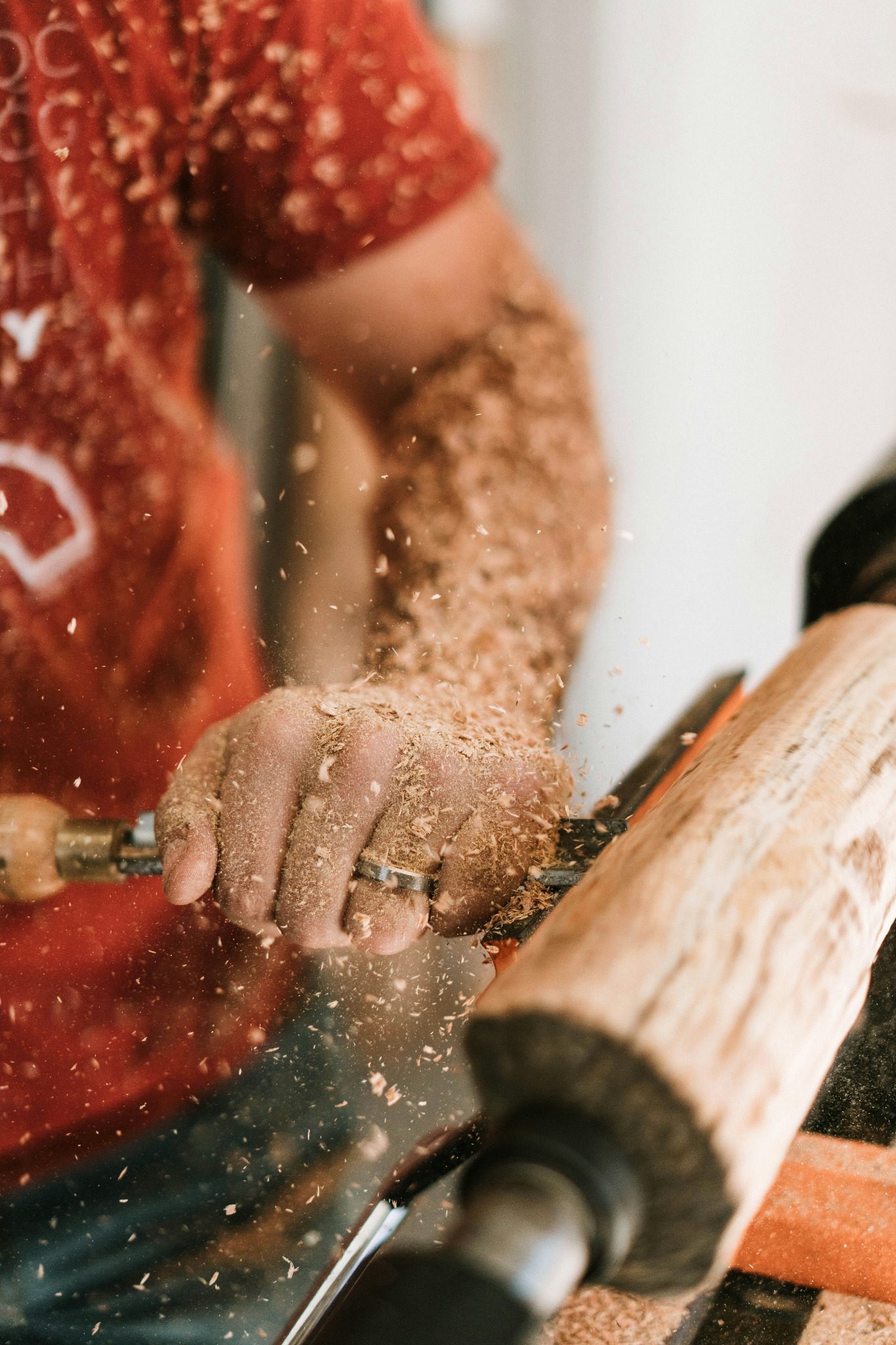 Woodturning with shavings flying