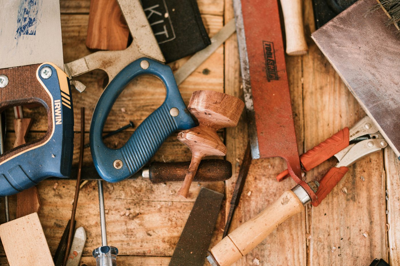 Old-school workshop tools on a wooden bench