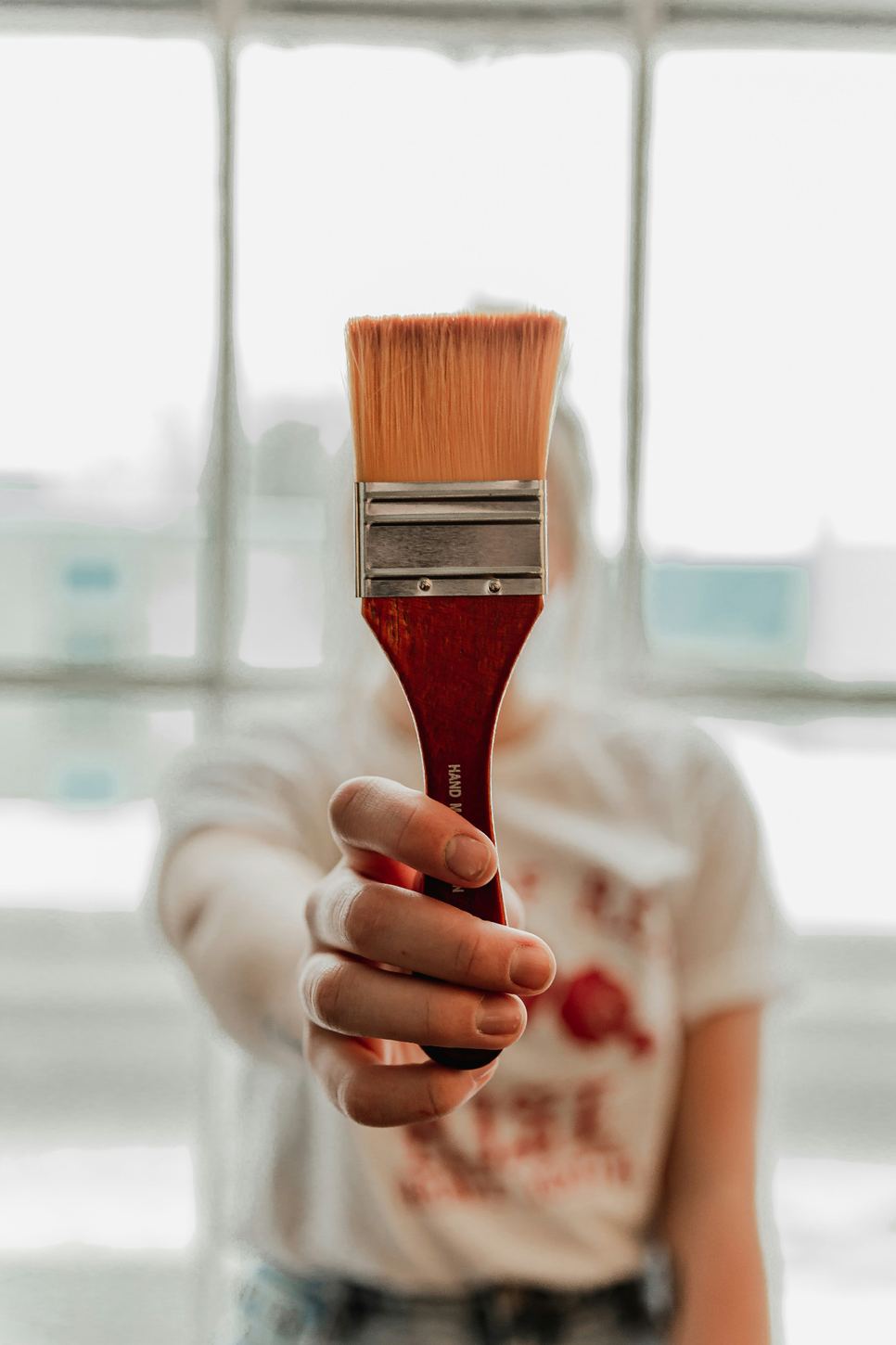 Painter holding a brush for precise interior painting